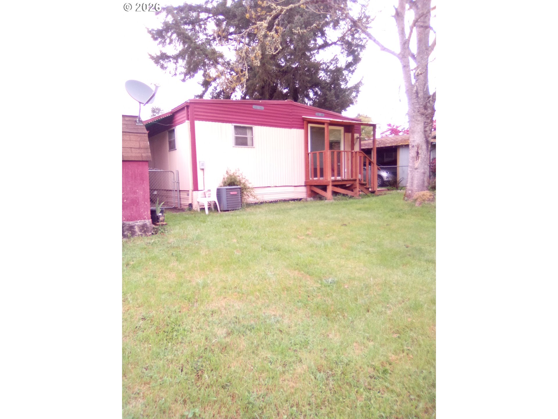 77500 South 6th Street Cottage Grove, OR 97424 - Photo 5 of 16 a view of a house with a yard garage and furniture