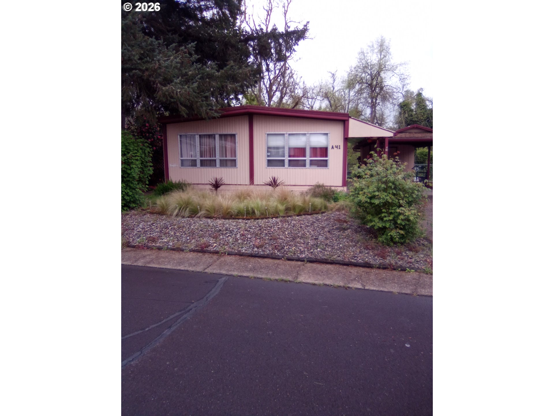 77500 South 6th Street Cottage Grove, OR 97424 - Photo 10 of 16 a view of a house with a yard and garage