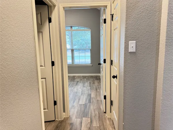 a view of a bathroom from a hallway
