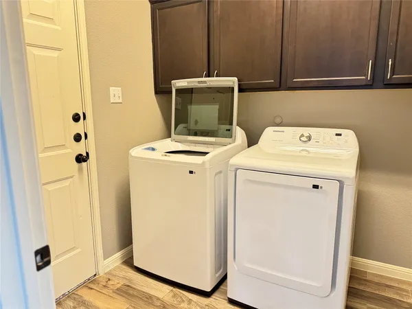 a utility room with dryer and washer