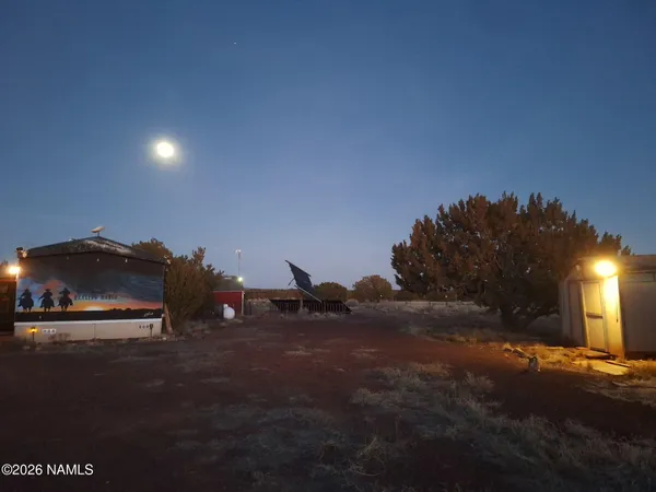 a kitchen with a stove a sink and cabinets