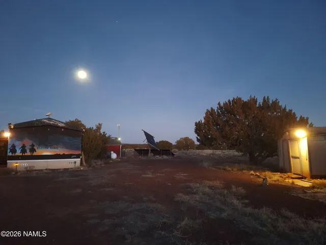 a living room with a couch and a chandelier