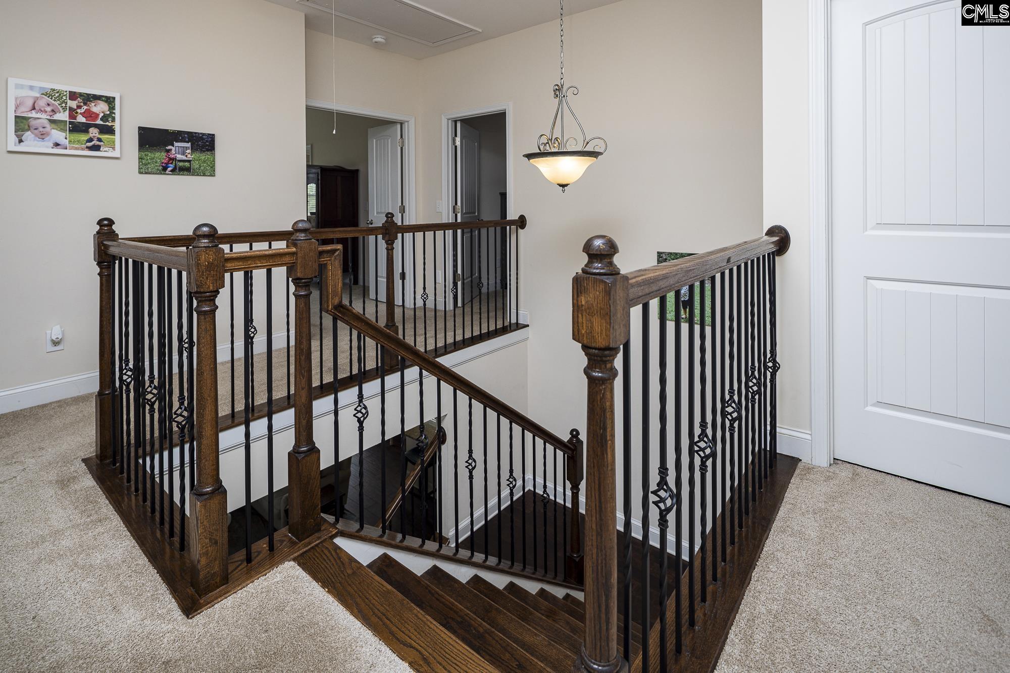 213 Sunset Point Drive Lexington, SC 29072 - Photo 17 of 35 a view of a hallway with windows and stairs
