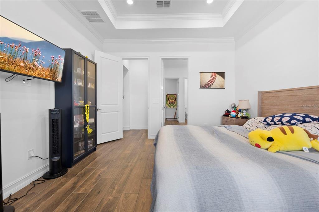 4898 Southern Valley Loop Brooksville, FL 34601 - Photo 14 of 81 a bedroom with a bed and a couch