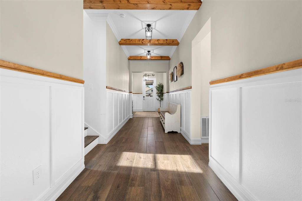 4898 Southern Valley Loop Brooksville, FL 34601 - Photo 20 of 81 a view of a hallway with wooden floor and staircase