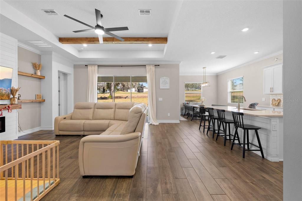 4898 Southern Valley Loop Brooksville, FL 34601 - Photo 21 of 81 a living room with furniture and a wooden floor