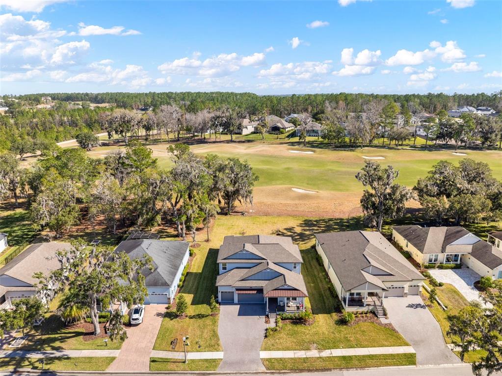 4898 Southern Valley Loop Brooksville, FL 34601 - Photo 28 of 81 an aerial view of residential building with outdoor space and ocean view