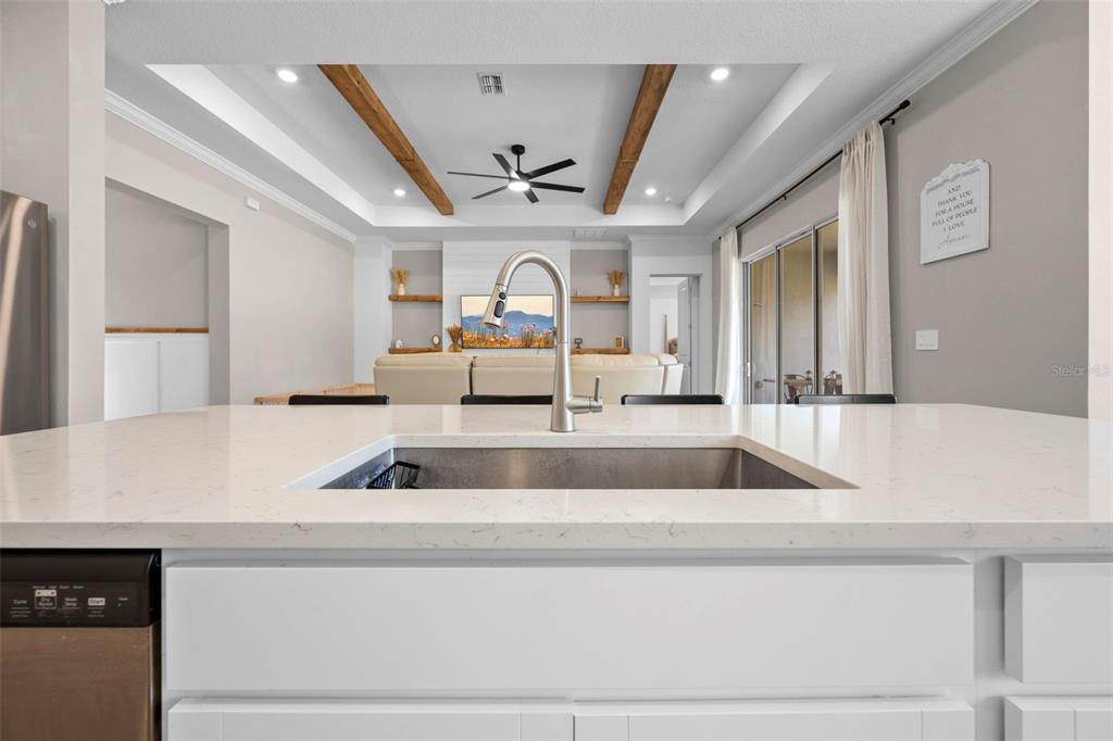 4898 Southern Valley Loop Brooksville, FL 34601 - Photo 36 of 81 a kitchen with a sink and a large mirror