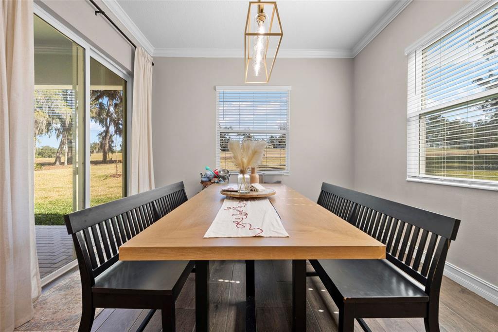 4898 Southern Valley Loop Brooksville, FL 34601 - Photo 39 of 81 a view of a dining room with furniture window and outside view