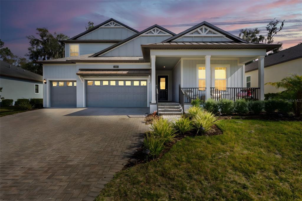 4898 Southern Valley Loop Brooksville, FL 34601 - Photo 4 of 81 front view of a house with a yard