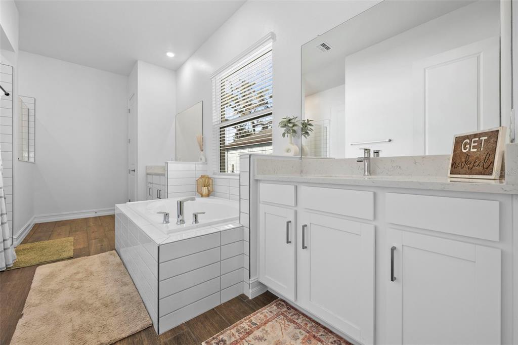 4898 Southern Valley Loop Brooksville, FL 34601 - Photo 46 of 81 a bathroom with a sink double vanity and mirror
