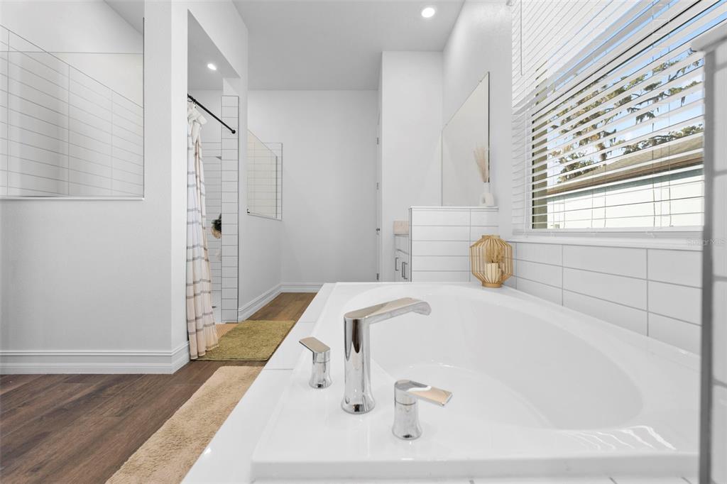 4898 Southern Valley Loop Brooksville, FL 34601 - Photo 47 of 81 a bathroom with a tub sink and a window