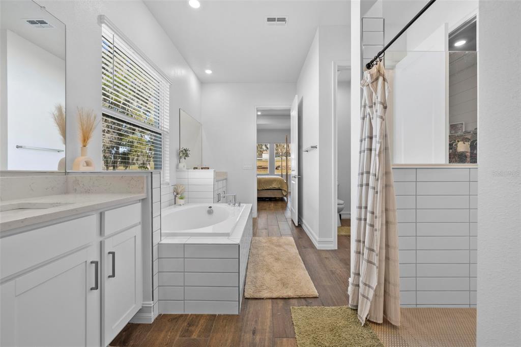 4898 Southern Valley Loop Brooksville, FL 34601 - Photo 49 of 81 a bathroom with a sink a toilet and shower