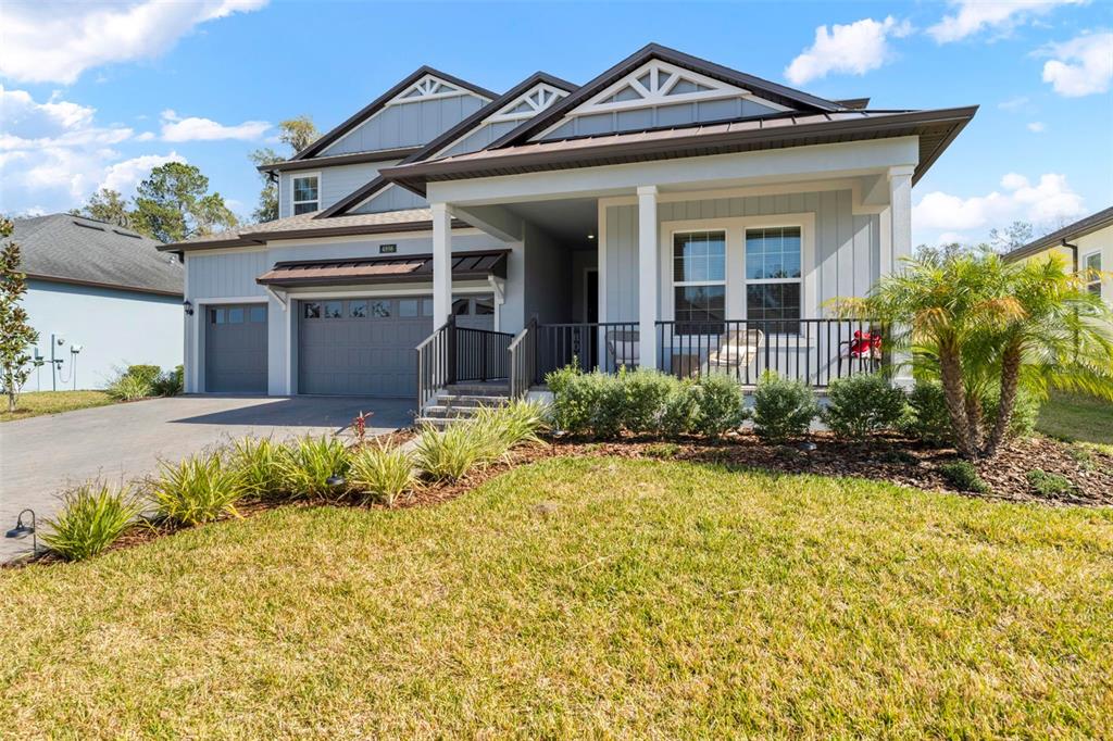 4898 Southern Valley Loop Brooksville, FL 34601 - Photo 53 of 81 a front view of a house with garden