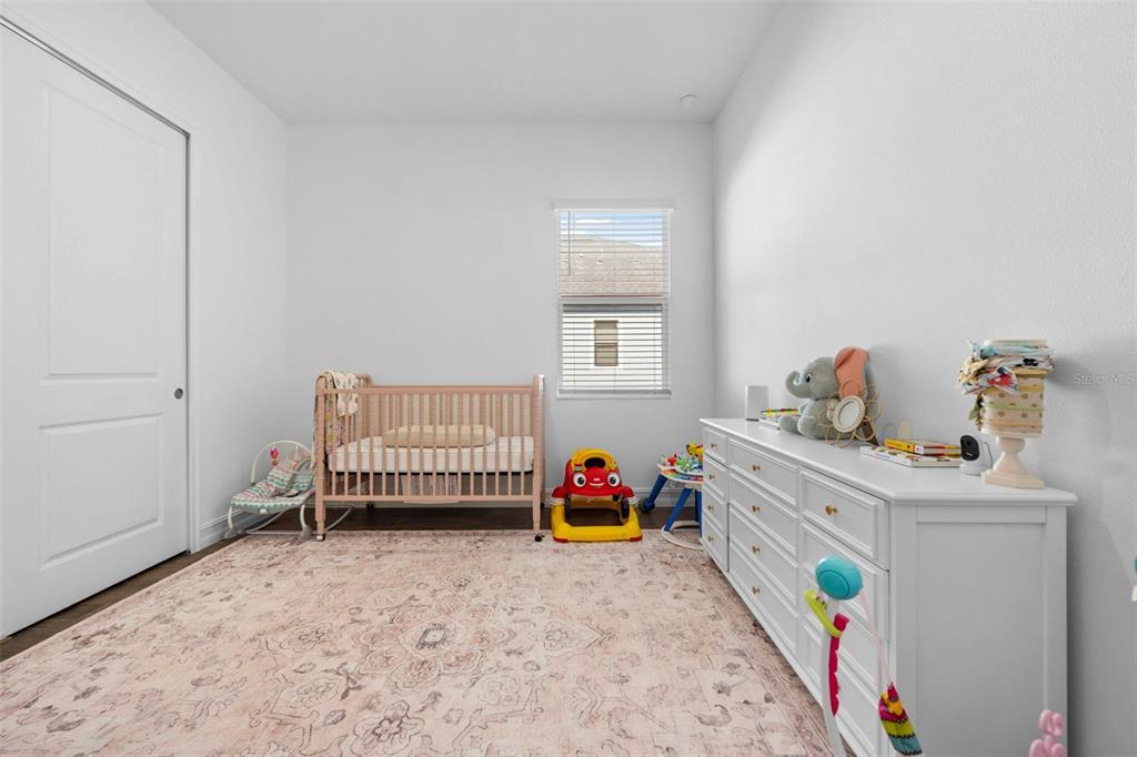 4898 Southern Valley Loop Brooksville, FL 34601 - Photo 54 of 81 a room with baby crib and a window