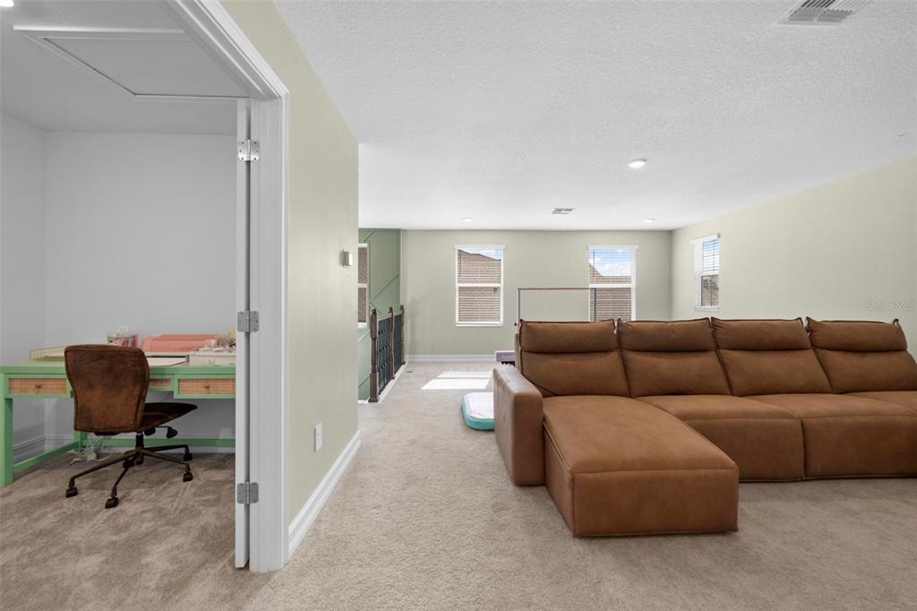 4898 Southern Valley Loop Brooksville, FL 34601 - Photo 62 of 81 a living room with furniture and a chair