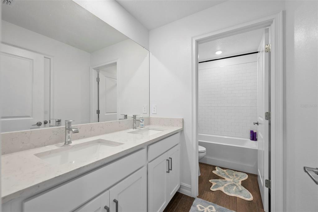 4898 Southern Valley Loop Brooksville, FL 34601 - Photo 68 of 81 a bathroom with a sink and a mirror