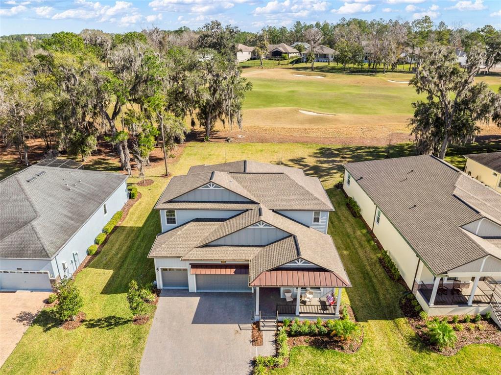 4898 Southern Valley Loop Brooksville, FL 34601 - Photo 69 of 81 an aerial view of residential houses with outdoor space