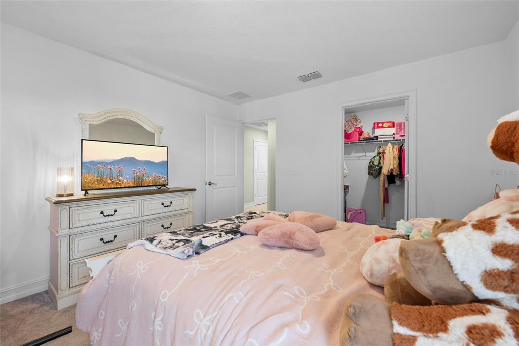4898 Southern Valley Loop Brooksville, FL 34601 - Photo 74 of 81 a bedroom with a bed and a flat screen tv