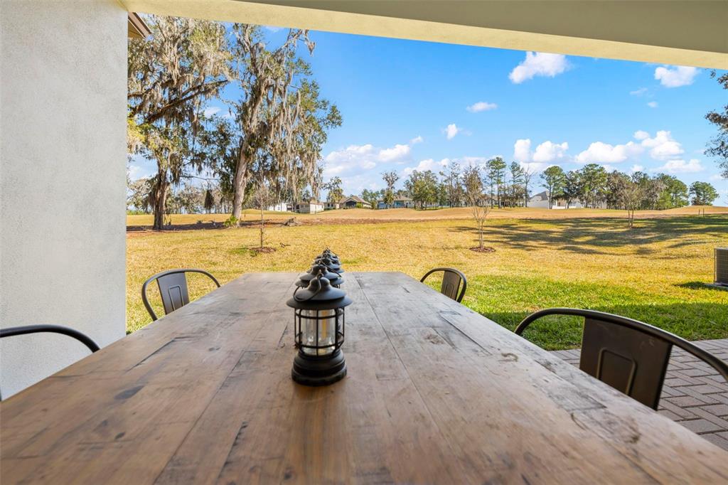 4898 Southern Valley Loop Brooksville, FL 34601 - Photo 78 of 81 a view of a swimming pool and an outdoor space