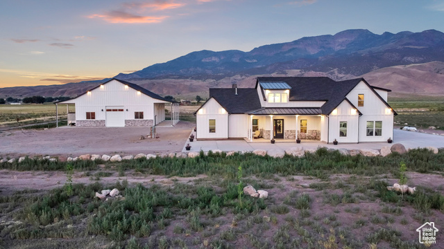 1952 Highway 118 Monroe, UT 84754 - Photo 68 of 88 Modern farmhouse featuring a standing seam roof, a mountain view, a metal roof, and an outdoor structure