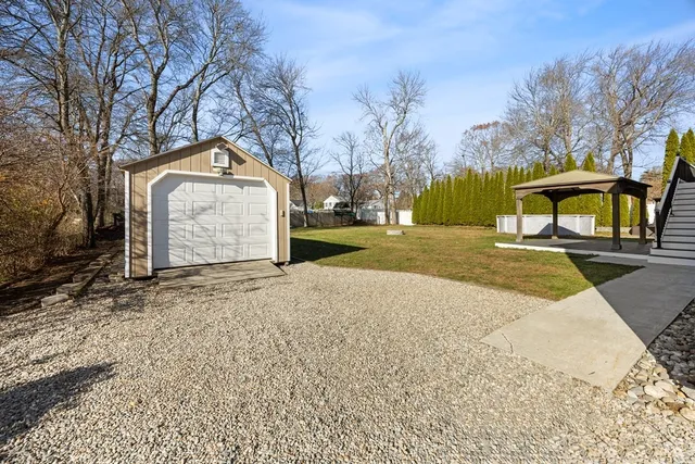 a view of a house with snow on the road