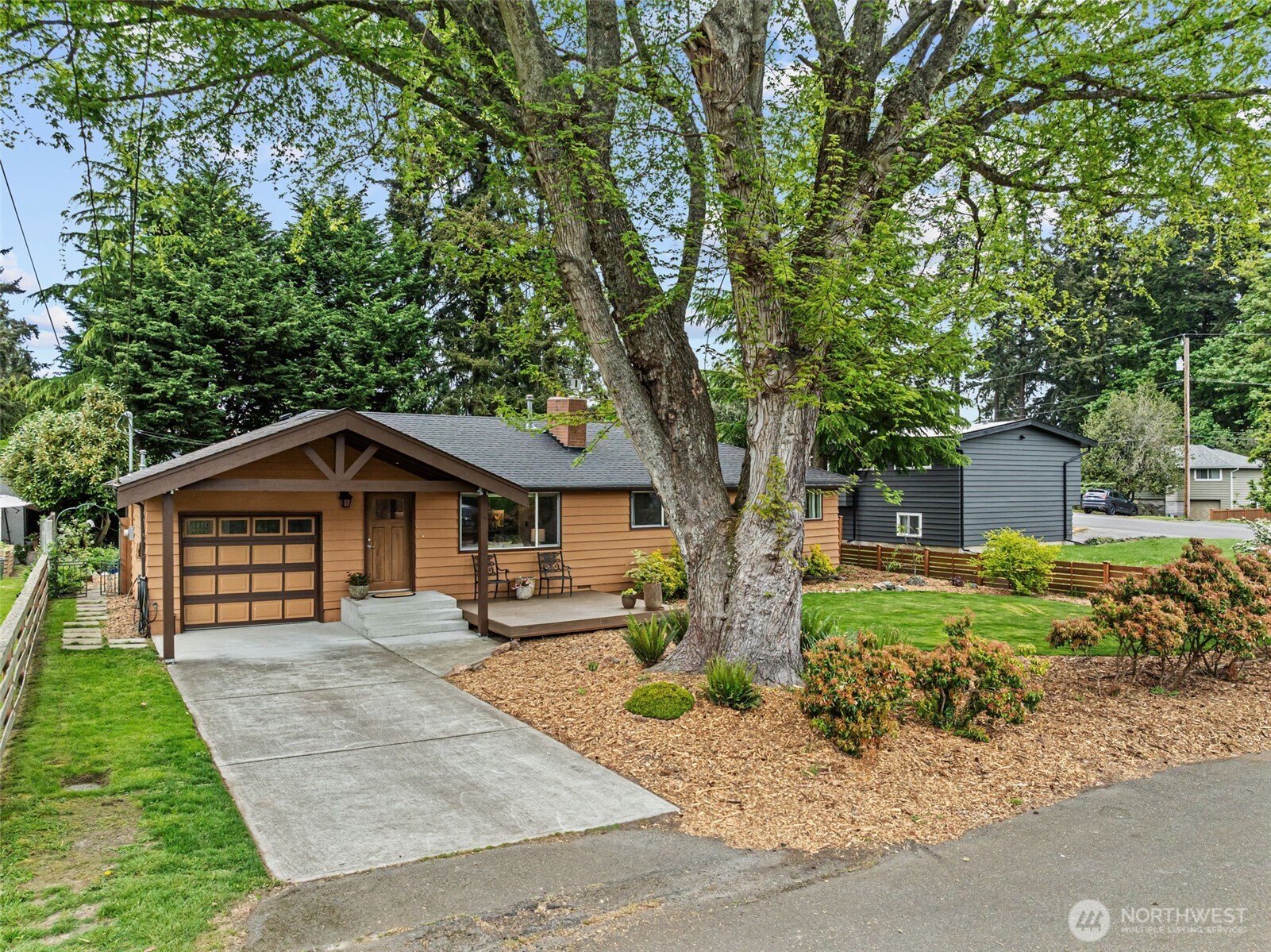 8629 223rd Street Southwest Edmonds, WA 98026 - Photo 2 of 40 a front view of a house with a yard and large trees