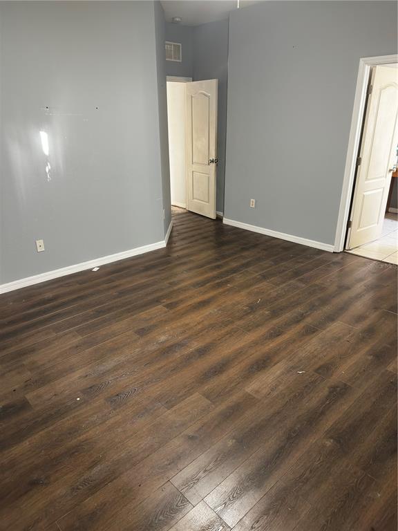 403 Thicket Crest Road Seffner, FL 33584 - Photo 10 of 10 an empty room with wooden floor and windows