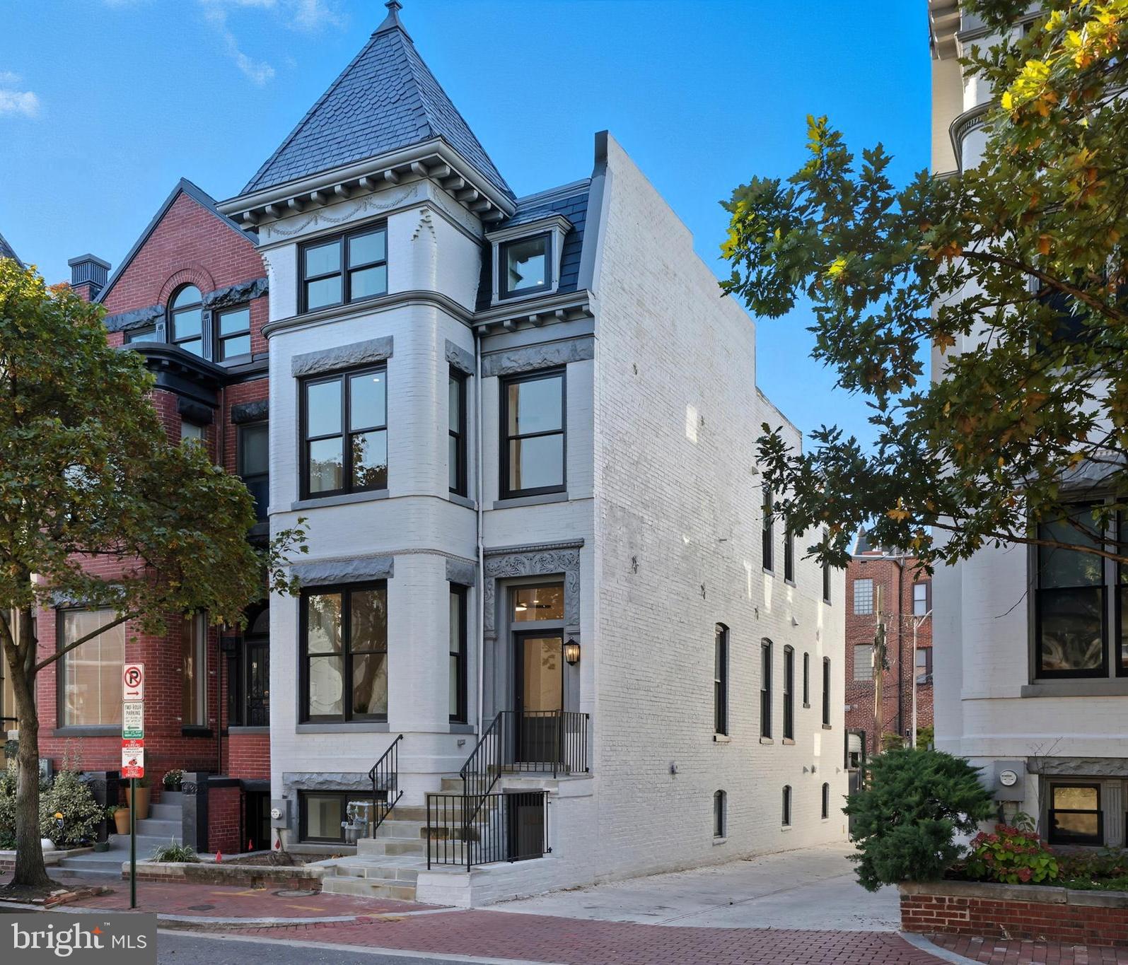a view of a building with a tree front of it