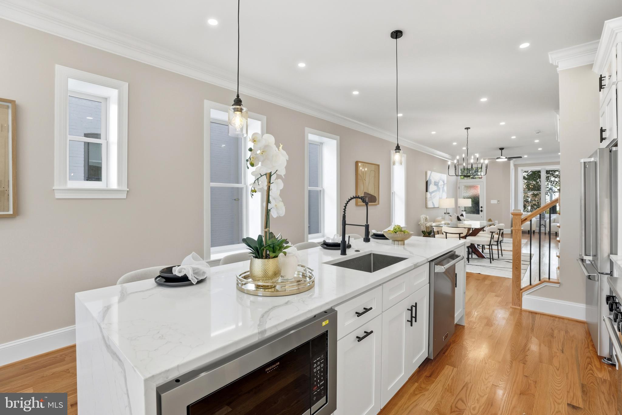 910 Westminster Street Northwest Washington, DC 20001 - Photo 15 of 66 a kitchen with counter top space and wooden floor