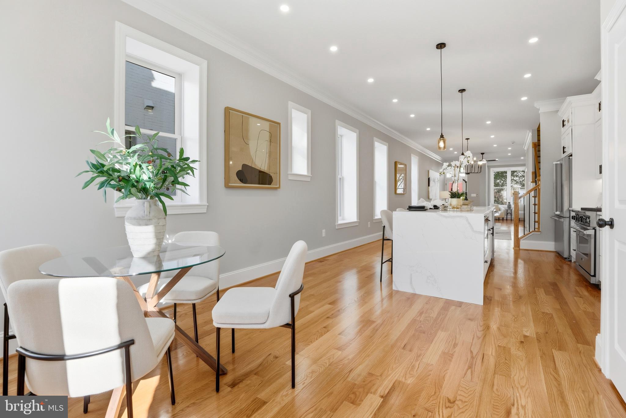 910 Westminster Street Northwest Washington, DC 20001 - Photo 18 of 66 a view of a dining room with furniture and a chandelier