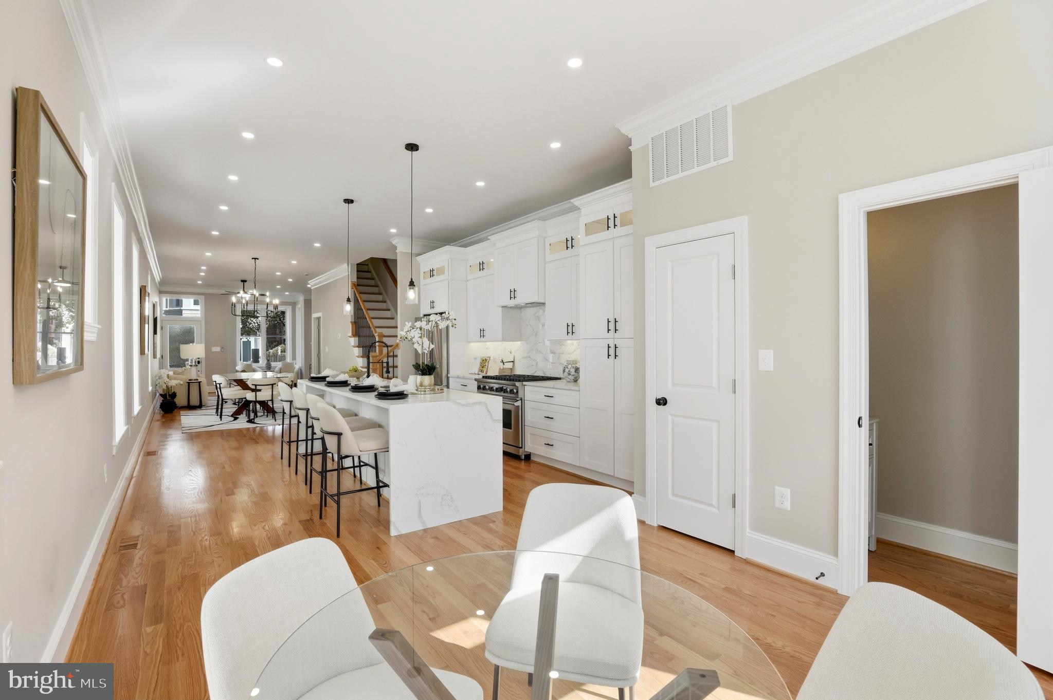 910 Westminster Street Northwest Washington, DC 20001 - Photo 19 of 66 a living room with lots of furniture and a wooden floor