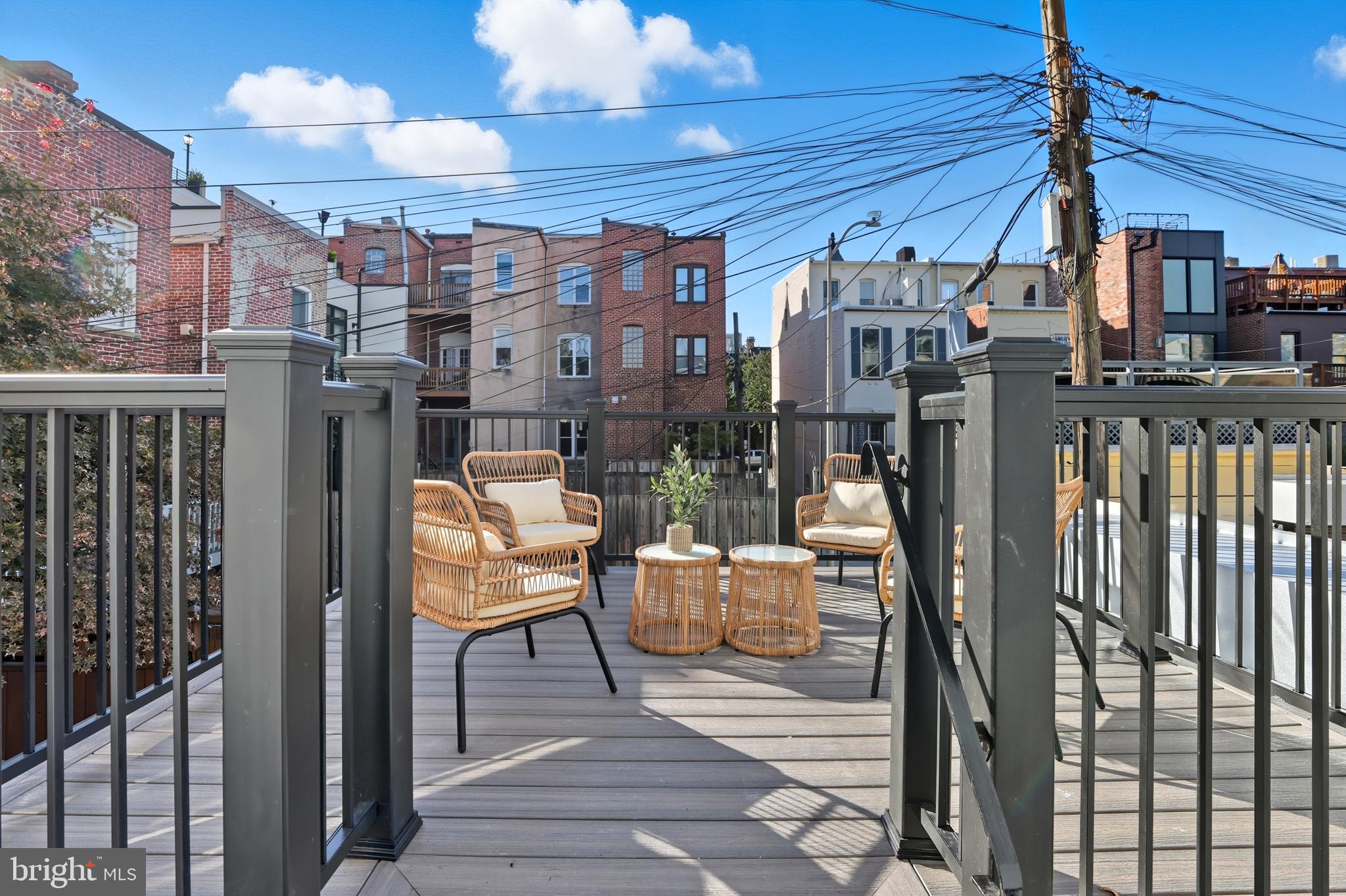 910 Westminster Street Northwest Washington, DC 20001 - Photo 21 of 66 a view of a patio with a table and chairs and potted plants