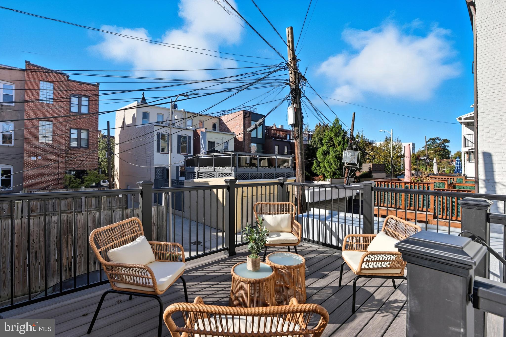 910 Westminster Street Northwest Washington, DC 20001 - Photo 23 of 66 a view of a balcony with two chairs and a table