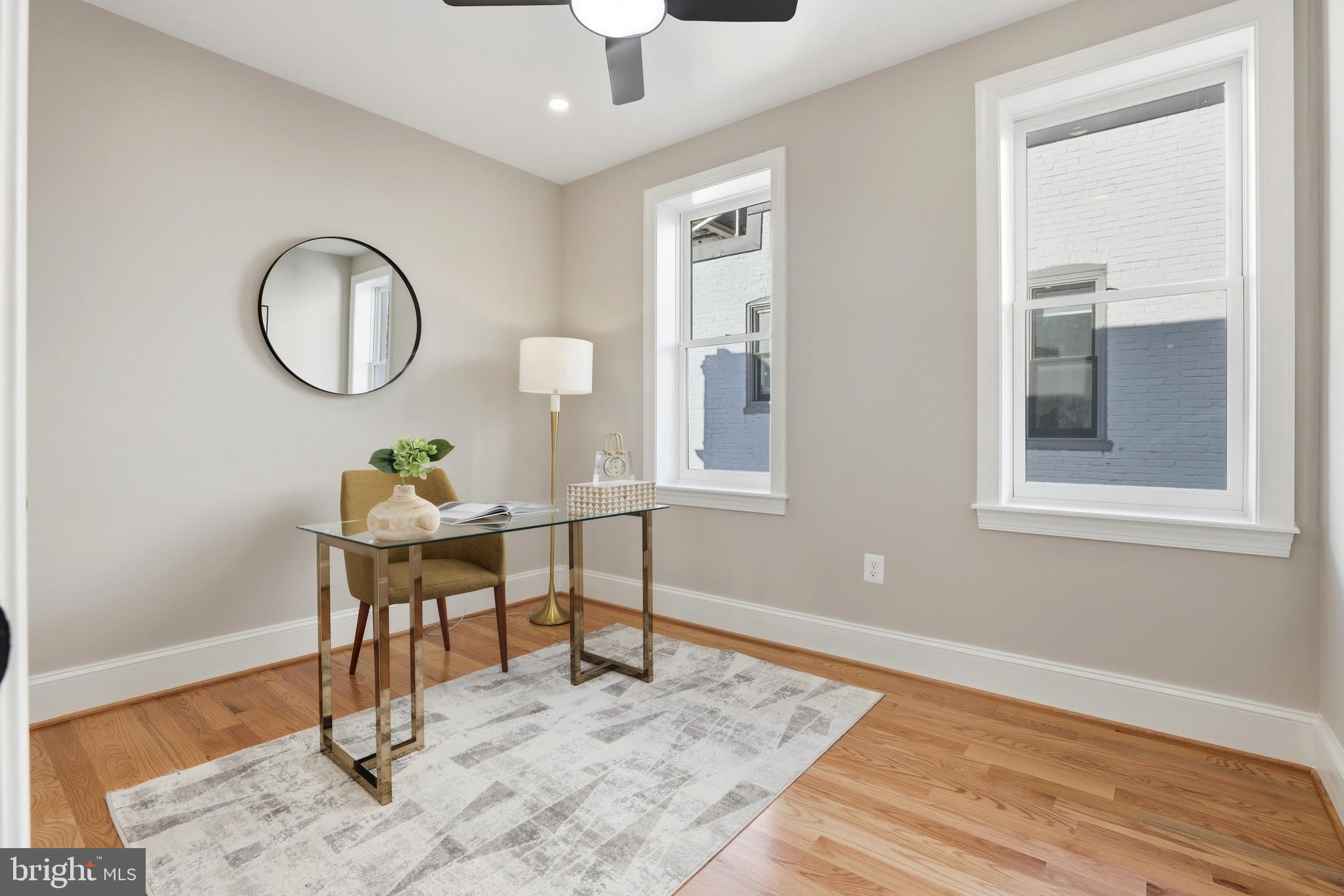 910 Westminster Street Northwest Washington, DC 20001 - Photo 27 of 66 a workspace with furniture wooden floor and a window