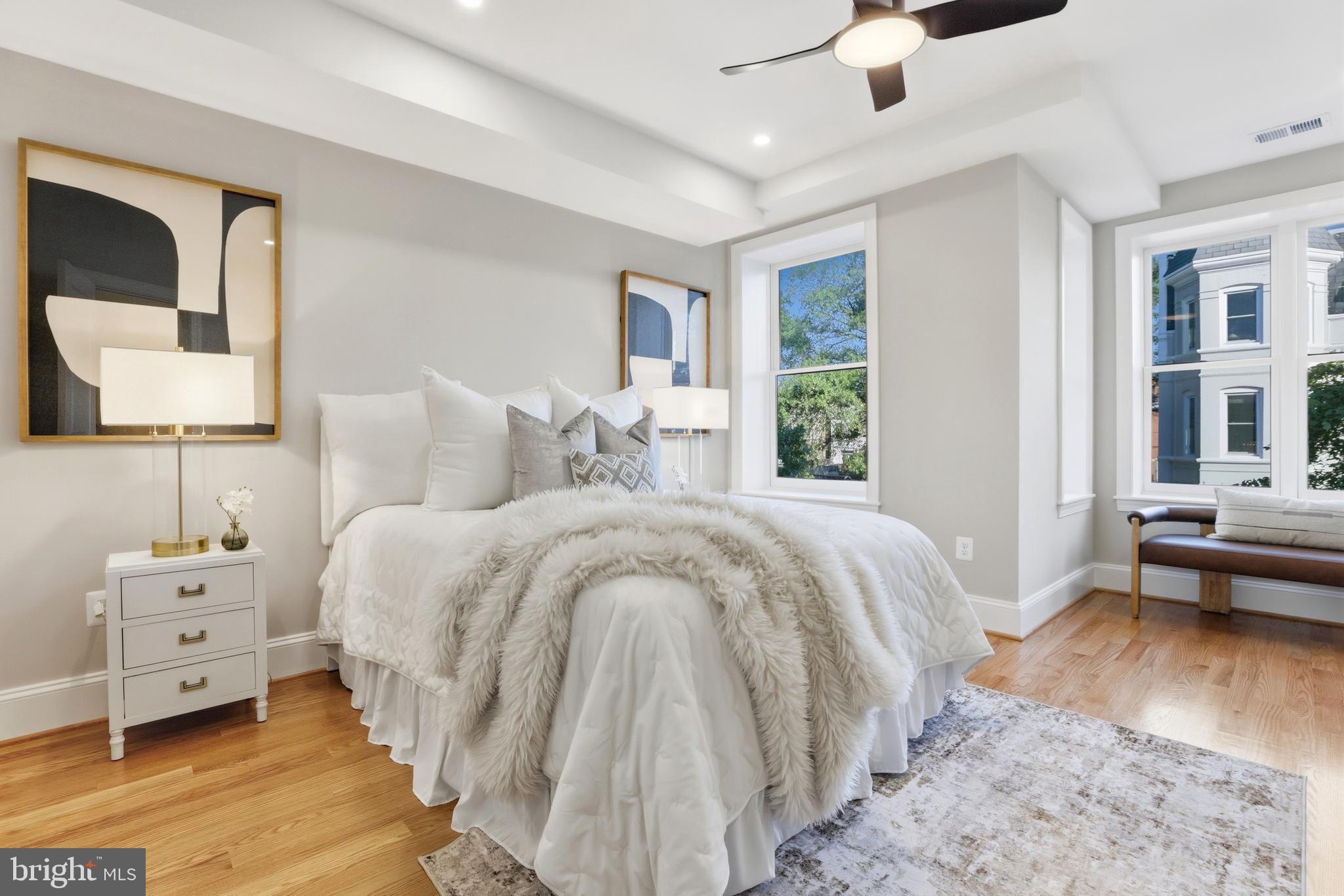 910 Westminster Street Northwest Washington, DC 20001 - Photo 28 of 66 a spacious bedroom with a bed and a couch