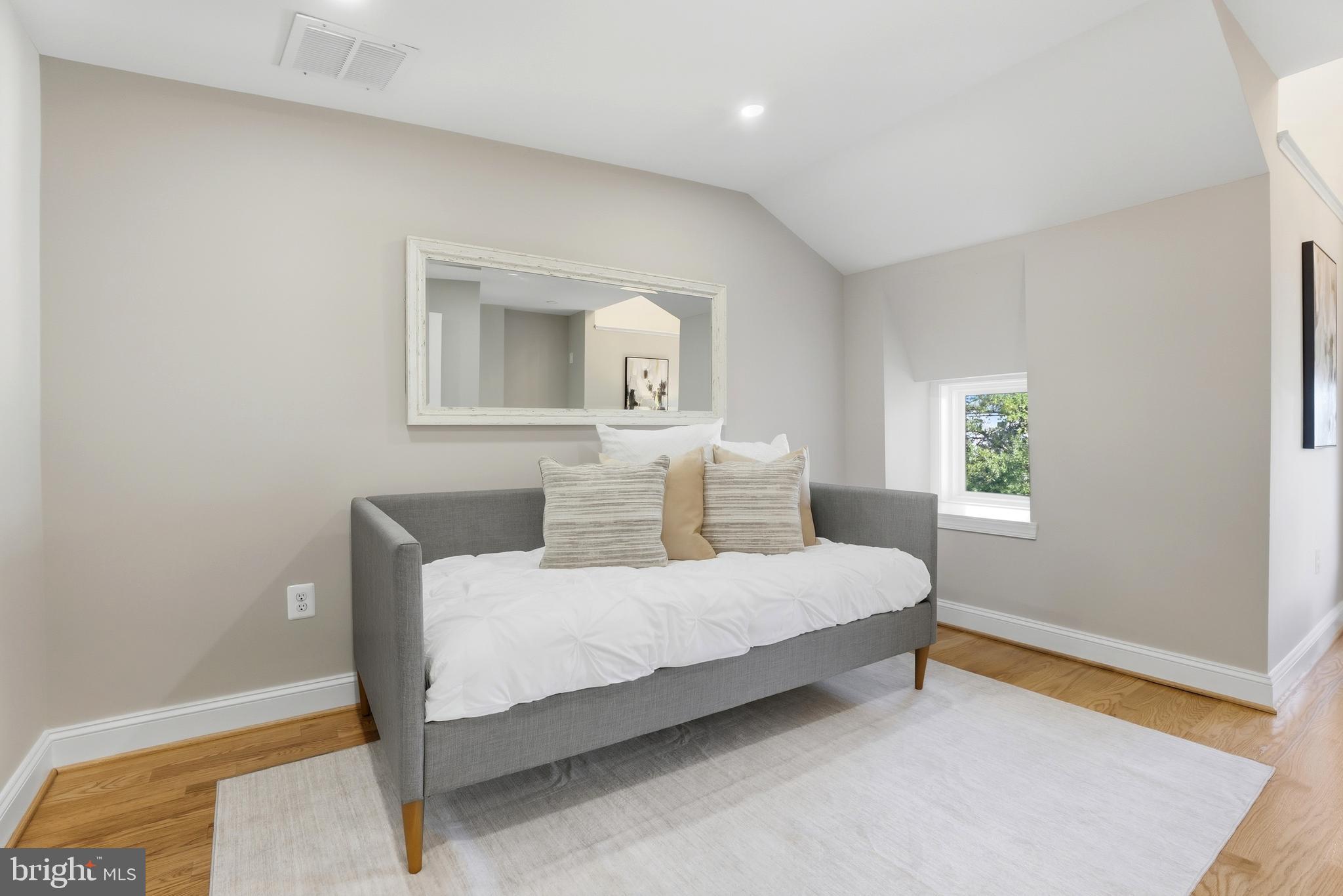 910 Westminster Street Northwest Washington, DC 20001 - Photo 37 of 66 a bedroom with a bed and a window