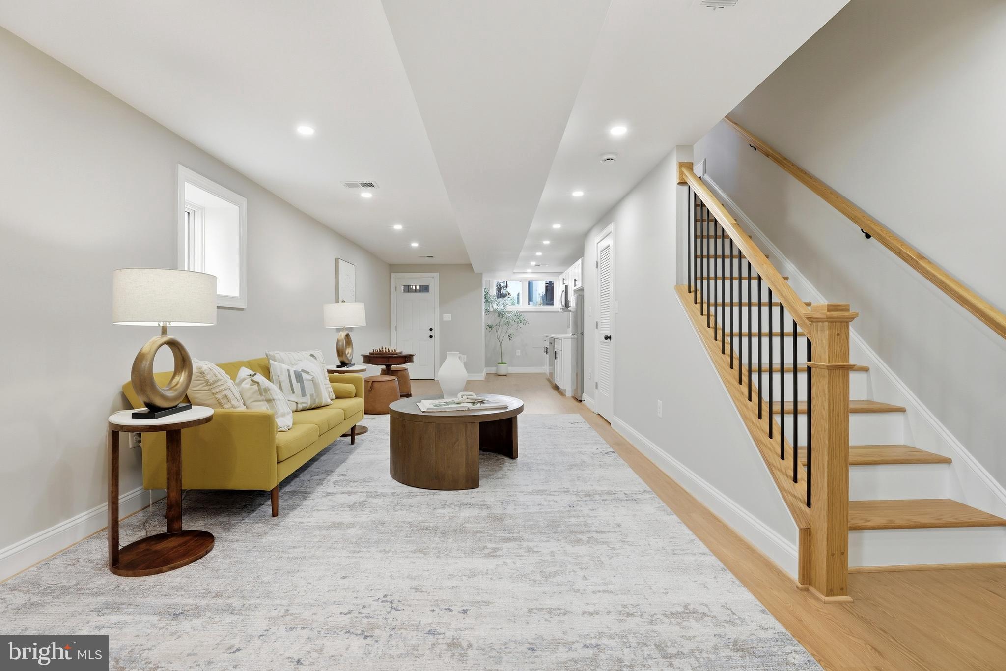910 Westminster Street Northwest Washington, DC 20001 - Photo 44 of 66 a living room with furniture a rug and a window