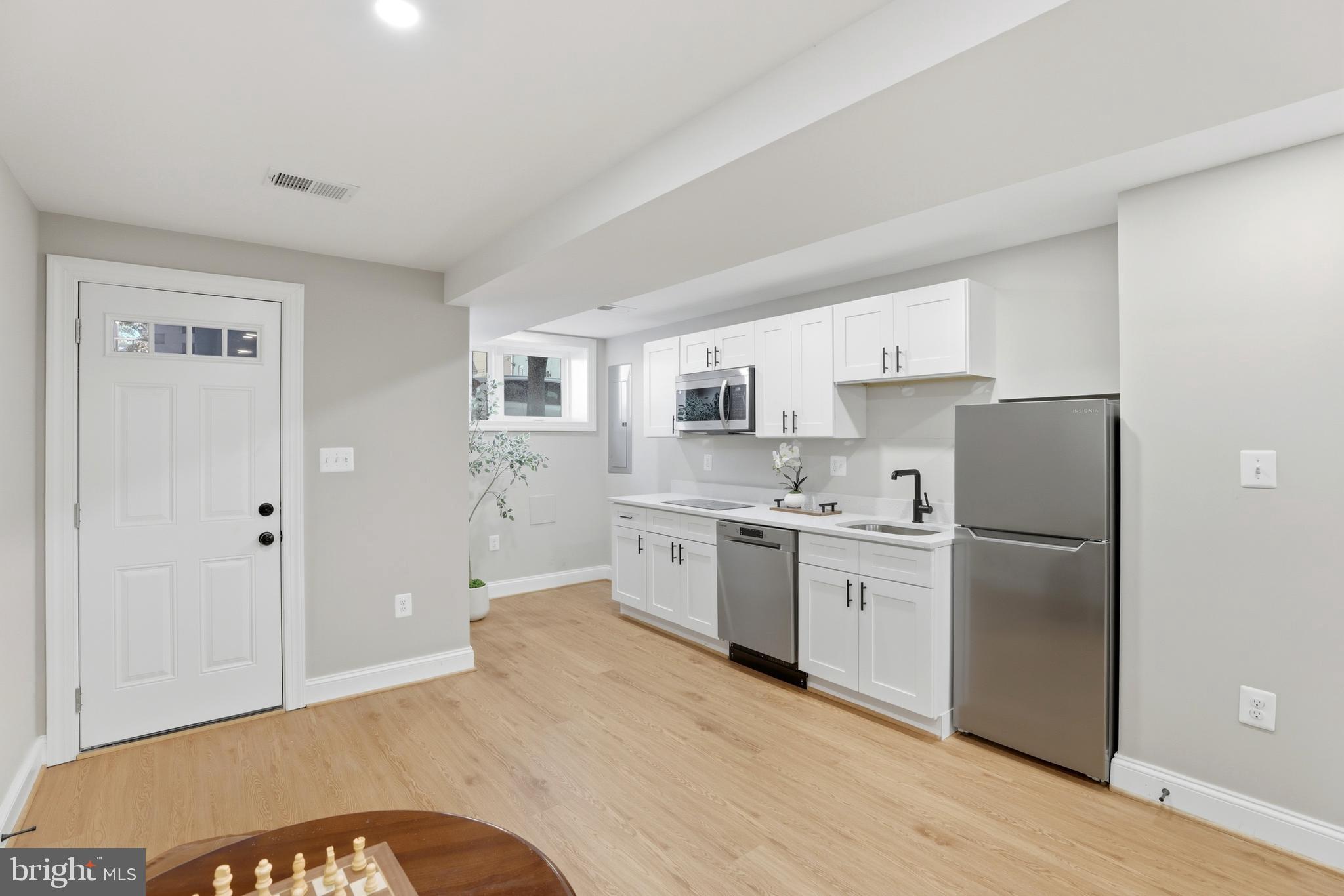 910 Westminster Street Northwest Washington, DC 20001 - Photo 47 of 66 a kitchen with stainless steel appliances a refrigerator sink and cabinets