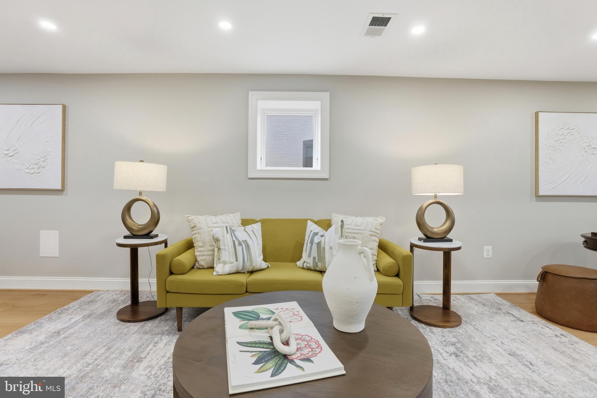 910 Westminster Street Northwest Washington, DC 20001 - Photo 51 of 66 a living room with furniture and a lamp