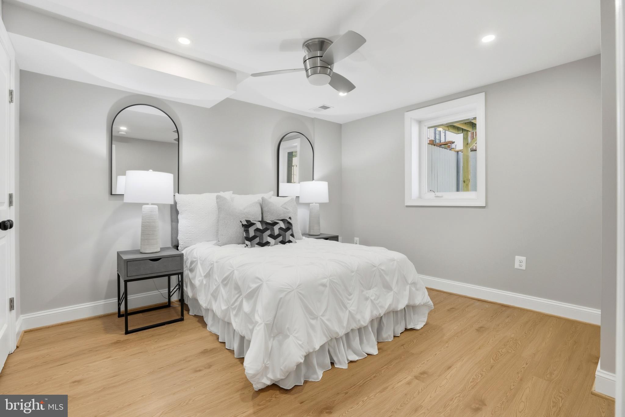 910 Westminster Street Northwest Washington, DC 20001 - Photo 55 of 66 a bedroom with a bed and a lamp