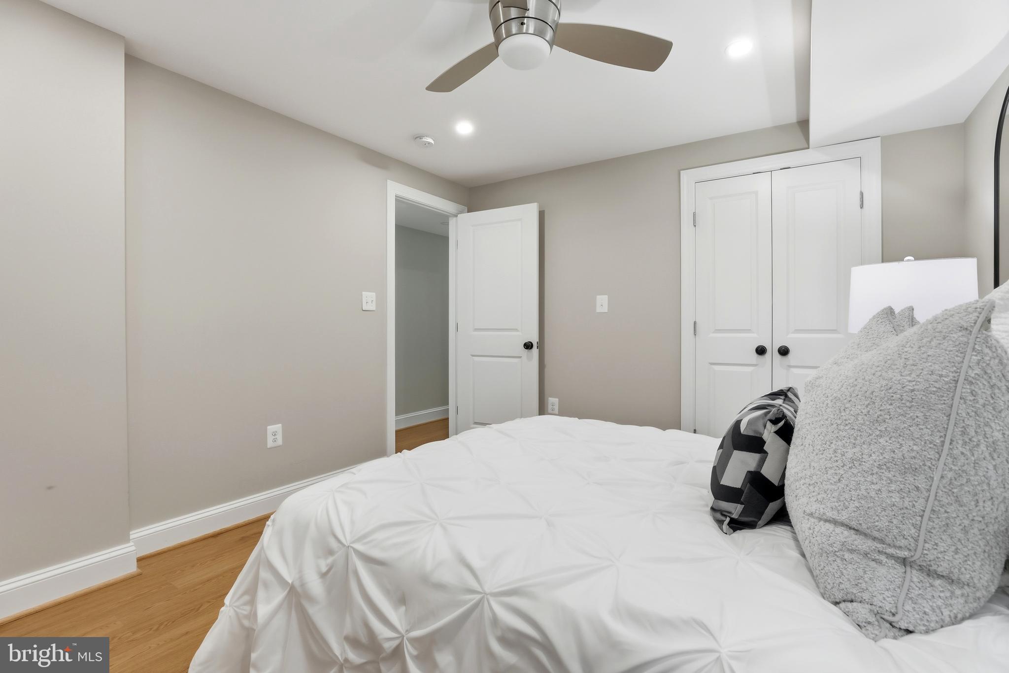 910 Westminster Street Northwest Washington, DC 20001 - Photo 56 of 66 a bedroom with a bed and a chandelier
