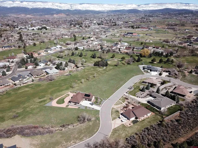 an aerial view of a house with a lake view