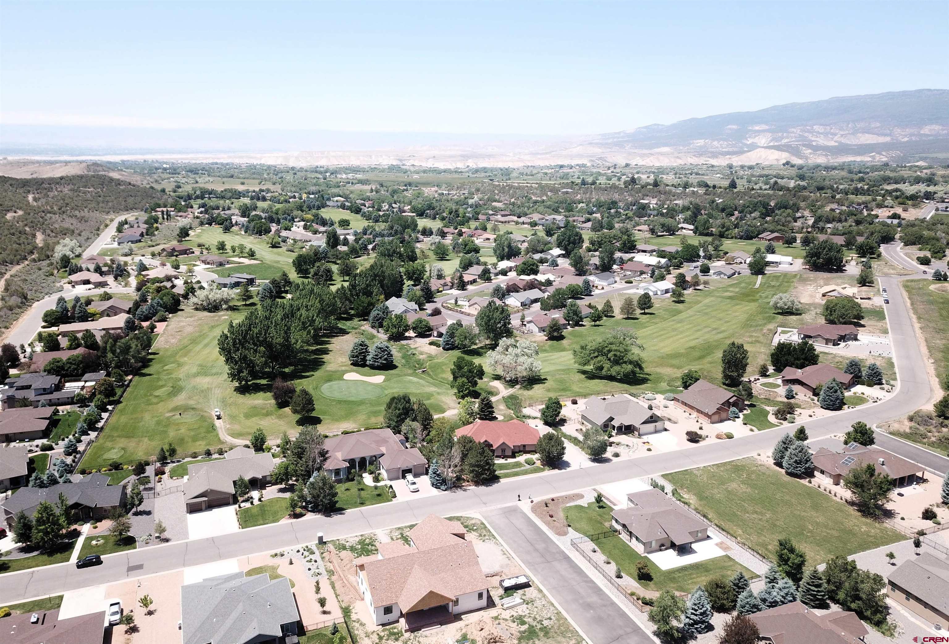 855 Southeast Pine Street Cedaredge, CO 81413 - Photo 2 of 8 an aerial view of a city with lots of residential buildings