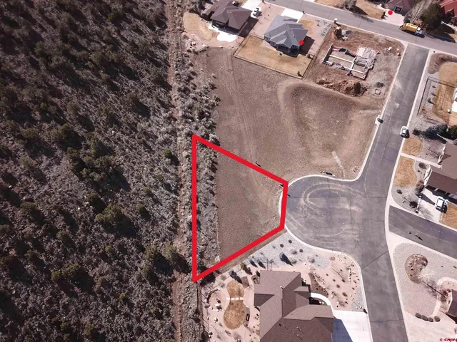 an aerial view of a houses with outdoor space