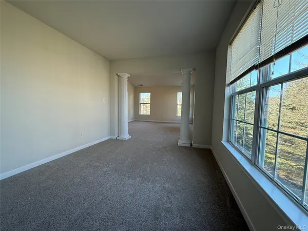 a view of a big room with large windows