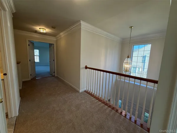 a view of a hallway with windows