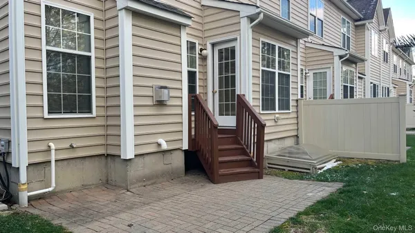 a view of a house with a door and a window