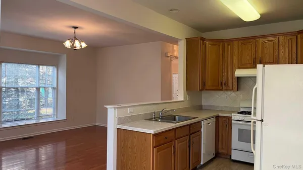 a kitchen with a stove and a refrigerator