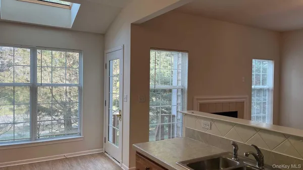 a living room with a fireplace and a window